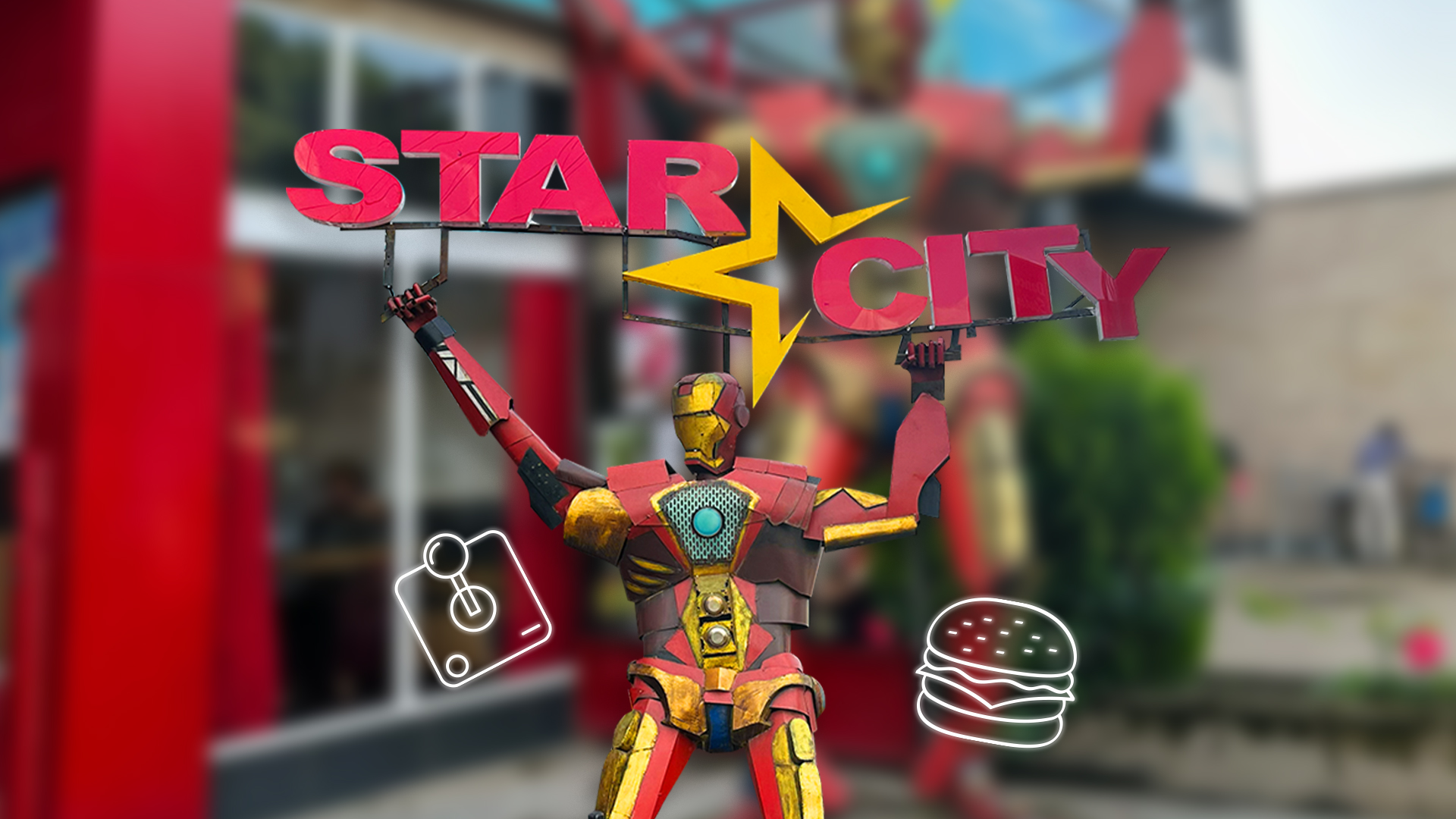 Star City robot mascot holding up the Star City sign